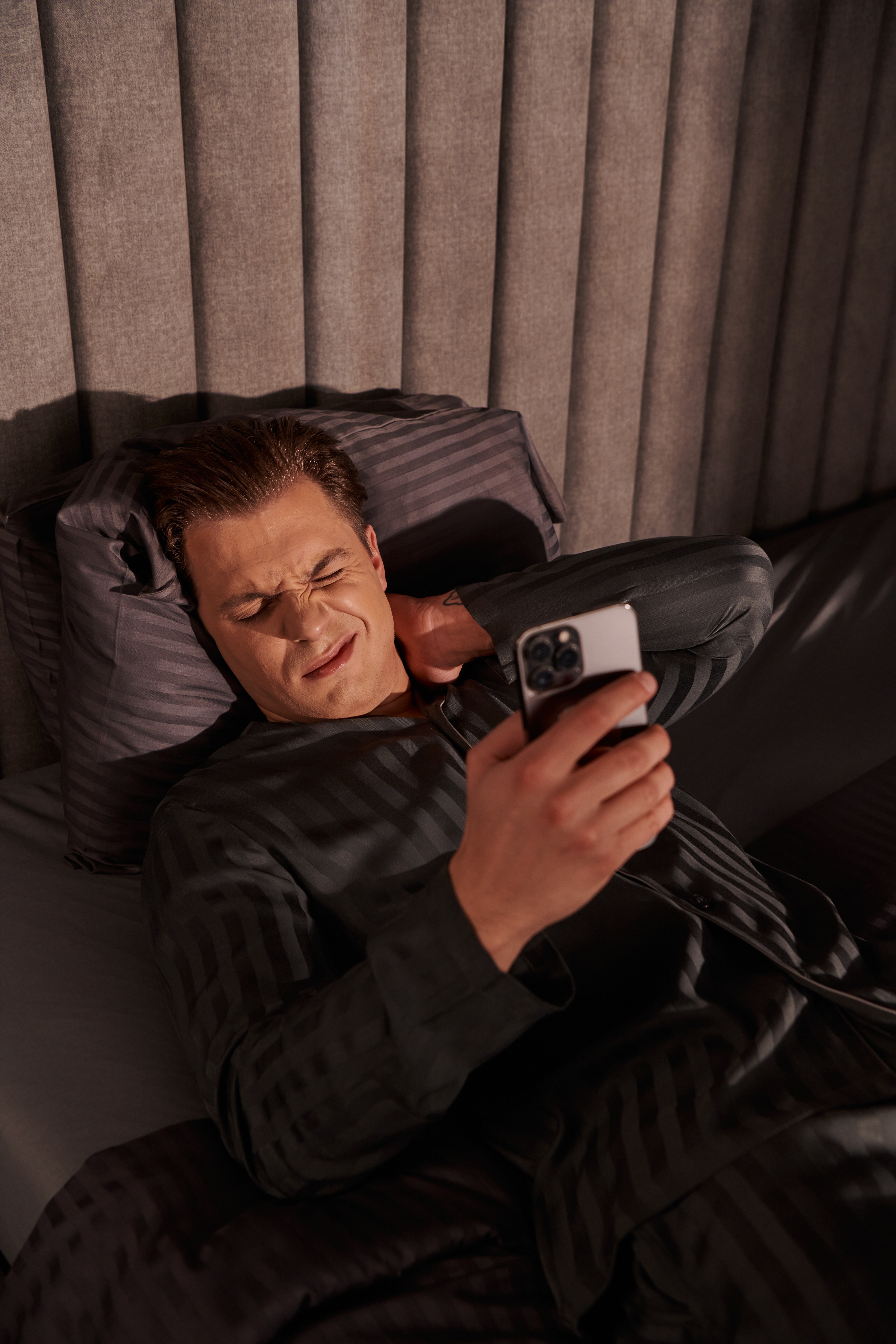 Man awake in the middle of the night, unable to sleep